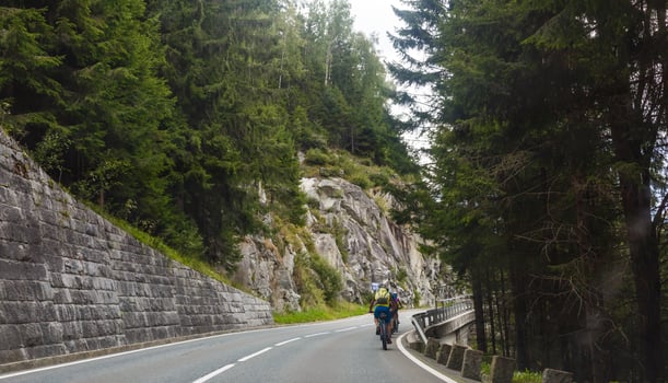 Road turning in the mountains, Alps background photo