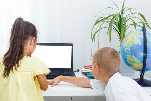 Two students working at laptop photo