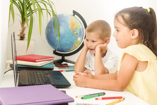 Happy children smiling and laughing in the classroom photo