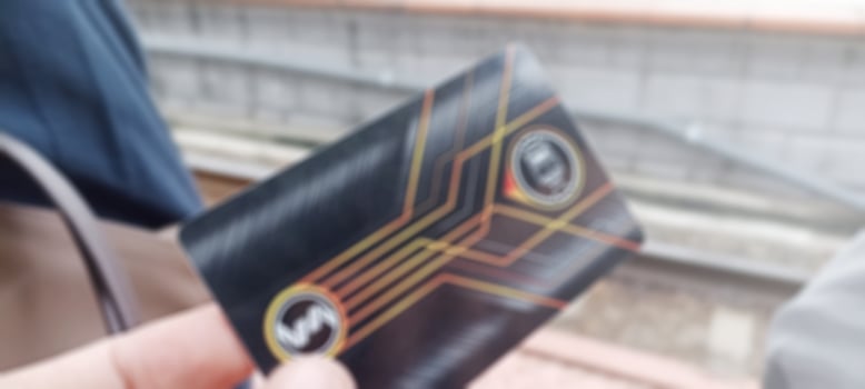Jakarta, Indonesia. April 2, 2023. Photo of an Electric Train ticket with railroad tracks in the background