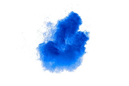 Blue color powder explosion cloud on white background.Blue dust particles splash. photo