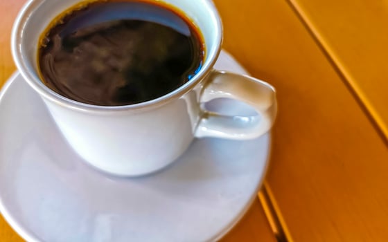 Cup of americano black coffee in restaurant Mexico. photo