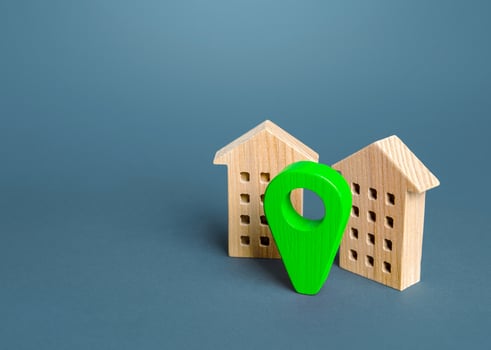 Residential buildings and green location pin. Delivery service. Environment friendly. Modern eco housing options. Construction industry, land market. Licensing documentation permits. Realtor photo