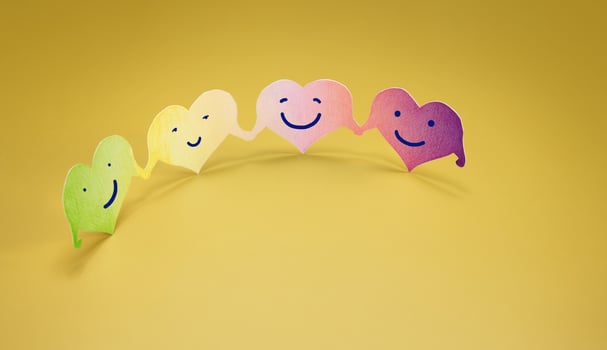 Love, Community and Unity Concepts. Social Cooperation. Organization or Charity. Paper cut as Happiness Heart Holding Hands Together. Group of Smiling Face Heart photo