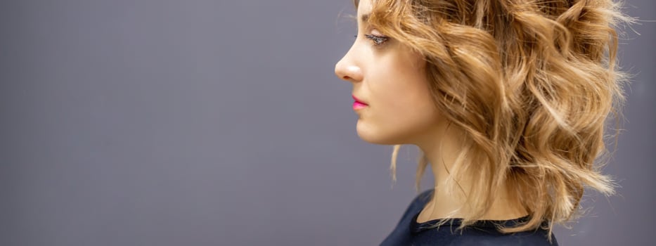 Woman with red long wavy hairstyle photo