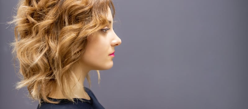 Woman with red long wavy hairstyle photo