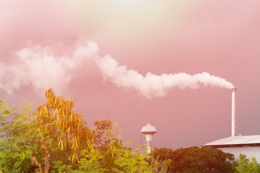 Huge factory chimney polluting the air,Tall chimney emitting  water vapor and smoke Pollution,Industry Causing Pollution photo
