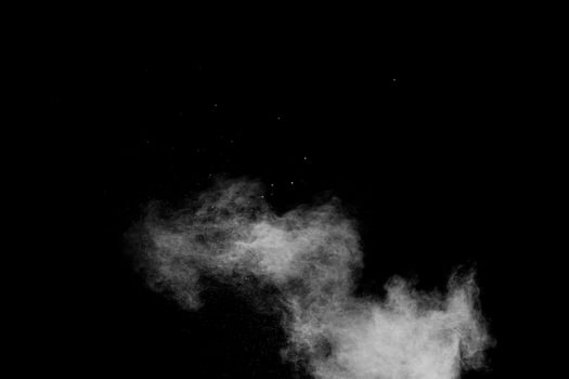 Freeze motion of brown dust explosion.Stopping the movement of brown powder. photo