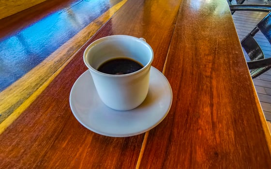 Cup of americano black coffee in restaurant Mexico. photo