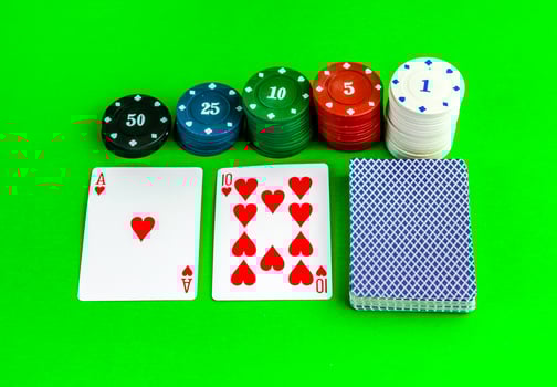 Poker game, ace and ten cards and chips. photo