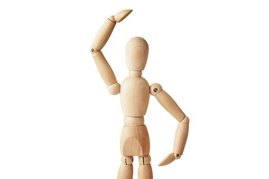 Wooden doll on white background isolated photo