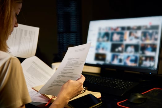 Tired woman works late at home workplace photo