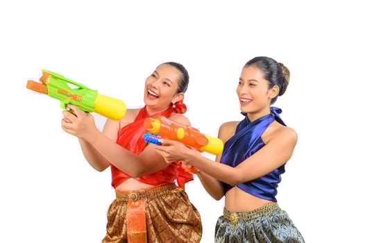 Two beautiful woman in Songkran festival with water gun photo