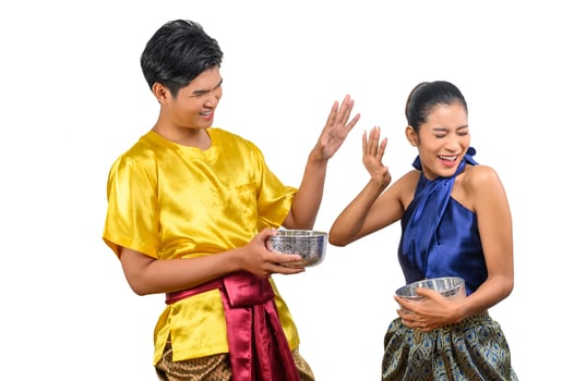 Young couple enjoy with water bowl on Songkran festival photo