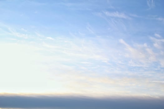 White light soft clouds floating in blue sky. Nature morning landscape background. Clear spring wind. Bright summer day. Winter calm air skyscape. Abstract panorama. Change climate. Low angle view photo