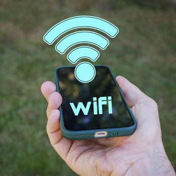 hand holding a smart phone with wifi icon, Wireless Fidelity photo
