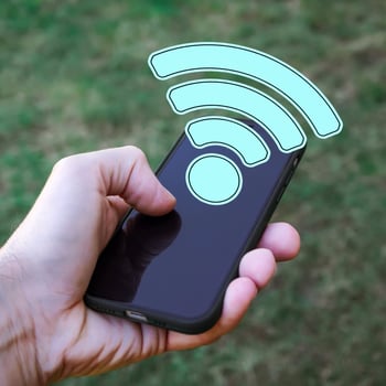 hand holding a smart phone with wifi icon, Wireless Fidelity photo