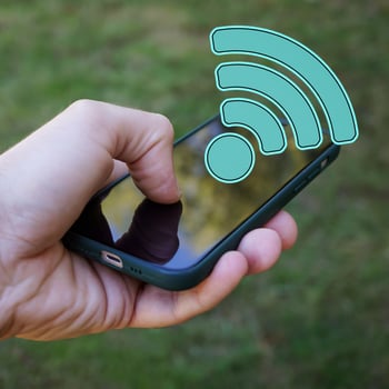 hand holding a smart phone with wifi icon, Wireless Fidelity photo