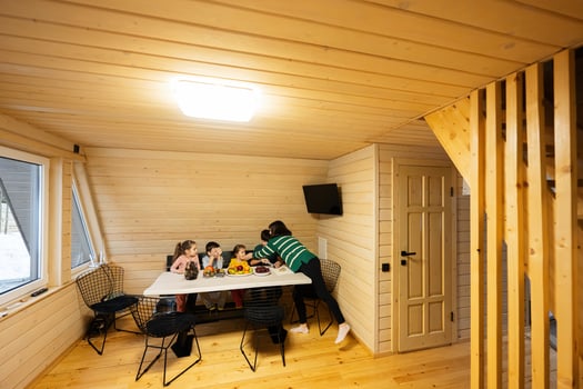 Mother with four children eat fruits in wooden country house on weekend. photo