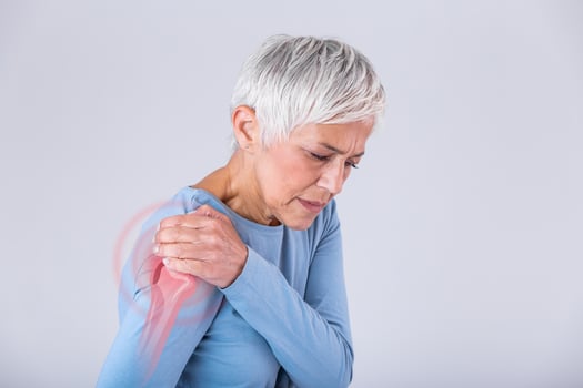 Senior woman with shoulder pain. Elderly woman is enduring awful ache. Shoulder Pain In An Elderly Person. Senior lady with shoulder pain photo