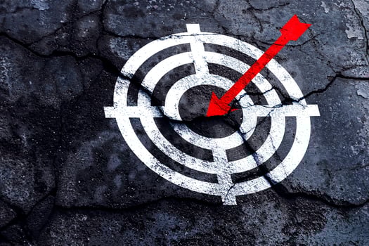 Target figure on broken wall, concept of achieving goal quality, Aim Target Red Symbols of goals and objectives over grunge background. business idea photo
