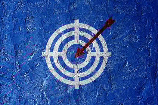 Target figure on blue wall, concept of achieving goal quality, Aim Target Red Symbols of goals and objectives over blue wall background. Business idea photo
