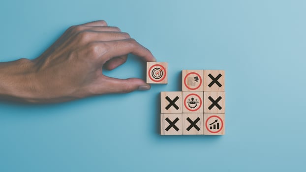 Human hand holding a wooden block ,business strategy concept and action plan ,Financial planning and business profit growth ,Setting business goals and focused concepts ,marketing strategy planning photo