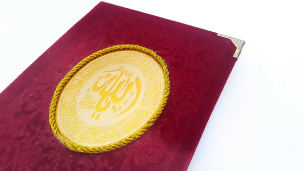 Surah Yasin book on white background. Islamic concept for daily pray. photo