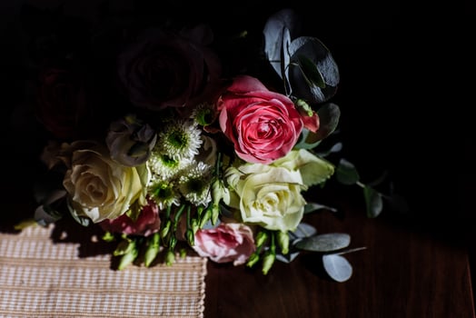 beautiful wedding bouquet. Stylish wedding bouquet bride of pink roses, white carnation and green flowers. Side view. Wedding decor. photo
