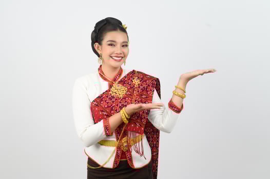 Portrait of Beautiful Thai Woman in Traditional Clothing standing Posing photo