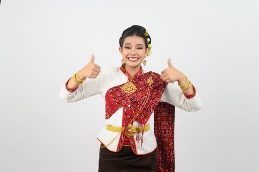 Young beautiful woman in northeastern dress stand and thumb up posture photo