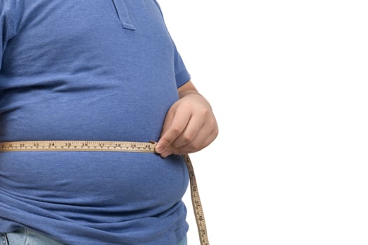 obese fat boy measuring tape of stomach isolated on white  background, photo