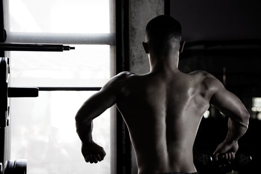 Sexy body of muscular young soldier Asian man in gym. Concept of health care, exercise fitness, Strong muscle mass, body enhancement, fat reduction for men's health supplement product presentation. photo