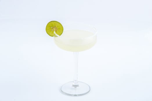 Classic margarita cocktail with salt and lime on the white background. photo