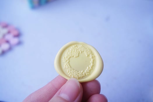pretty wax coins for a vintage look for wedding or invitation decoration photo