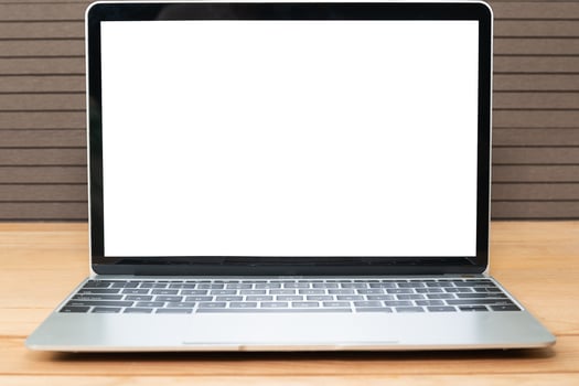 Front view of laptop mockup on wood photo