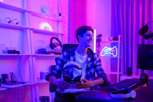 Young Caucasian man Pro Gamer have live streaming  playing video game,  using virtual reality glasses at home photo