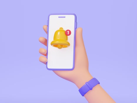 Notification bell - hand holding mobile phone with yellow bell on screen 3d render. photo