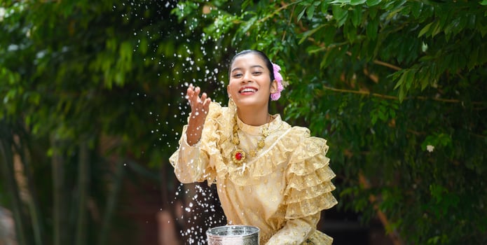 Portrait beautiful woman in Songkran festival with Thai Traditional costume photo