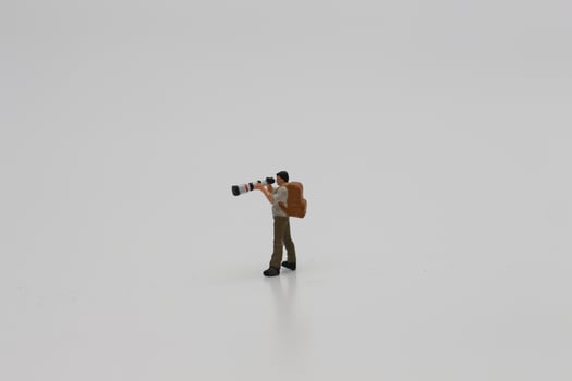 a close up of a miniature figure of a photographer photo