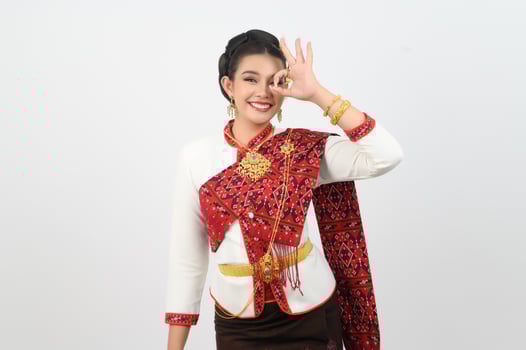 Young beautiful woman dress up in local culture in northern region with OK posture photo