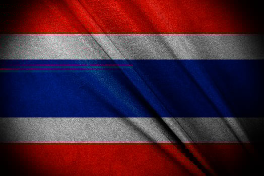 The Thailand Flag blowing, and  Waving in the Wind on Flagpole, on dark background photo