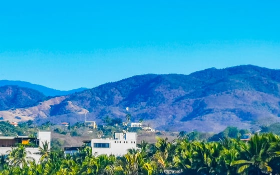 Mountain panorama cliffs rocks hilly tropical landscape Puerto Escondido Mexico. photo