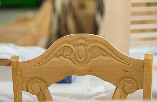 Furniture production from a natural tree. Production of chairs at the factory. photo