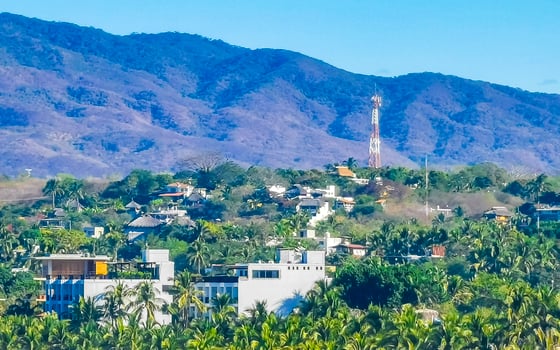 Mountain panorama cliffs rocks hilly tropical landscape Puerto Escondido Mexico. photo