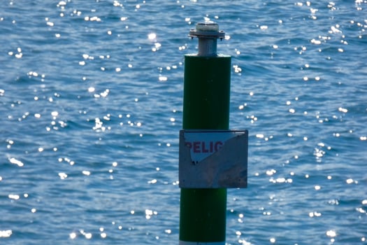 a rod to measure the height of water in a harbour photo