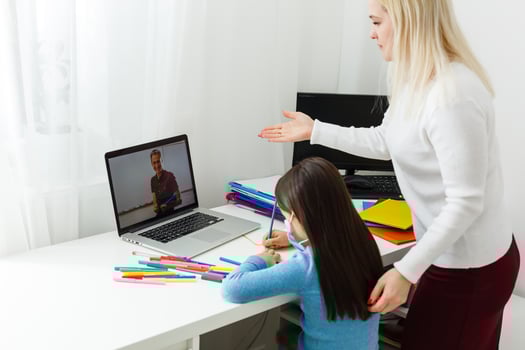 mother and daughter in protective mask do homework at distance home schooling, quarantine photo