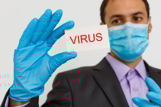 Boy in protective mask holds inscription Coronavirus photo
