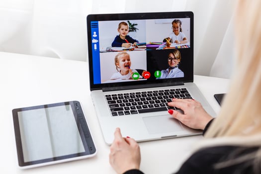 Woman video conferencing with tutor on laptop at home. Distance education concept. photo
