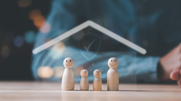 Wooden dolls and icons represent the protection and protection of family safety ,property and family risk reduction ,Caring and caring for loved ones ,life and property protection planning photo
